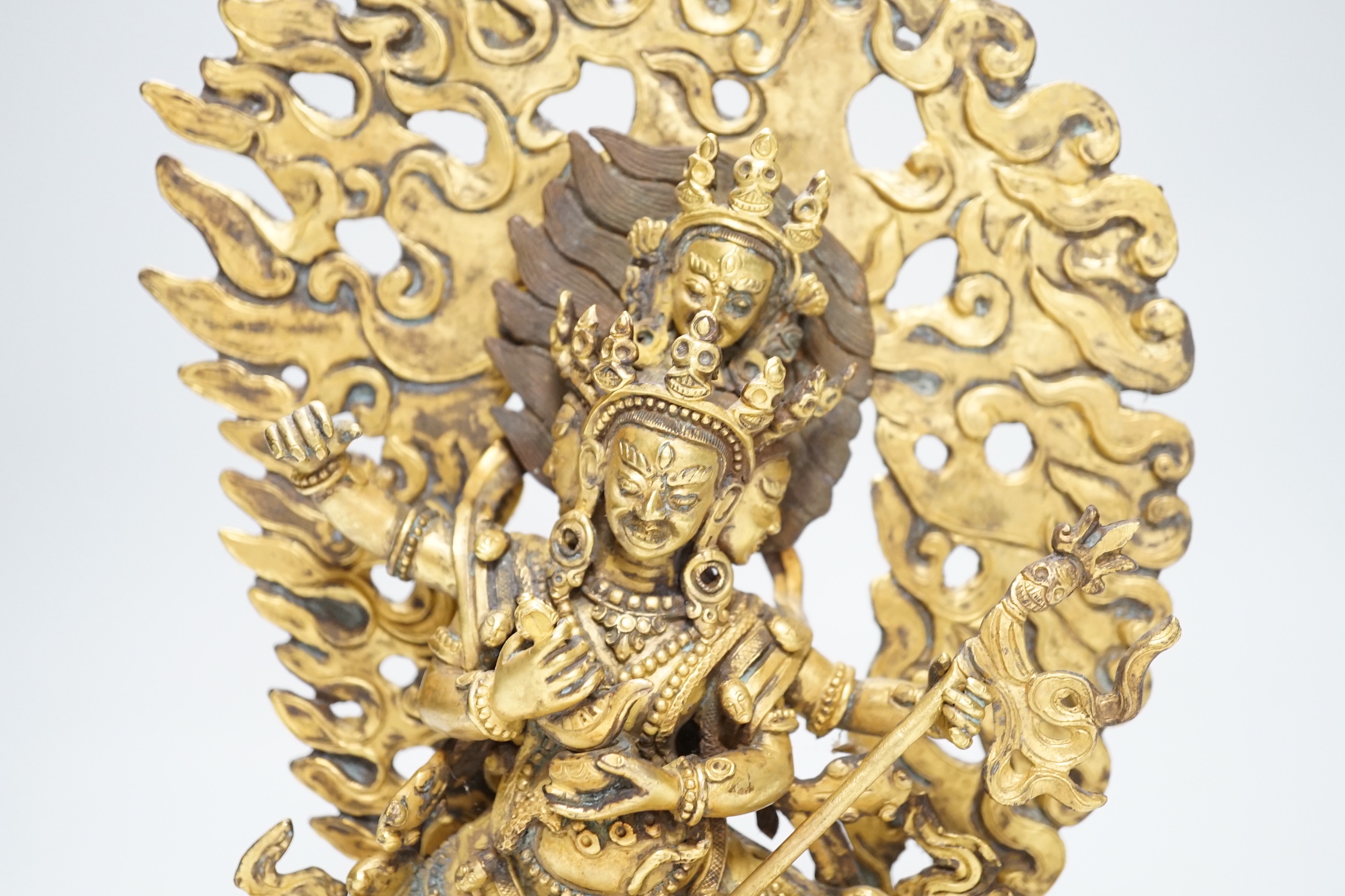 A Sino Tibetan gilt bronze figure of Mahakala, 23cm